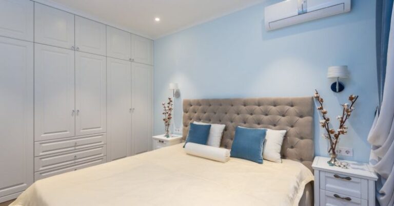 AC Technologies - Comfortable bed and white big wardrobe in elegant bedroom