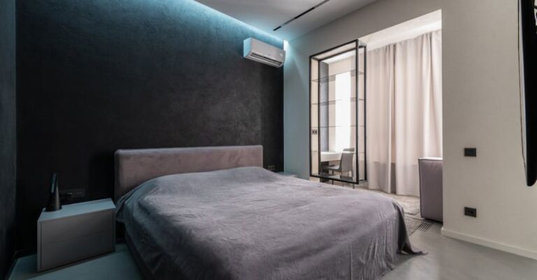 Air Conditioner - Interior design of contemporary spacious bedroom with comfortable soft bed with bedside table and air conditioner in apartment