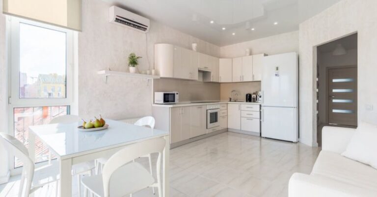 Air Conditioner - Interior of spacious light kitchen with dining zone