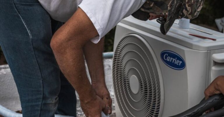 Air Conditioner - Man Taping a Hose