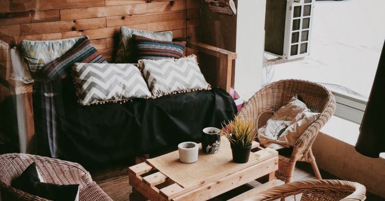 Air Conditioner - Couch and Three Woven Chairs Standing Beside Wooden Table on Patio