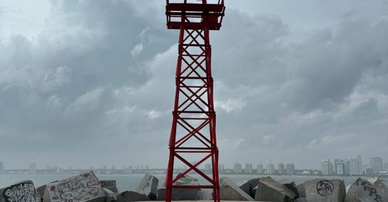 AC Installation - A red light tower on a concrete platform