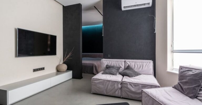 Air Conditioner - Cozy living room with sofas and TV set