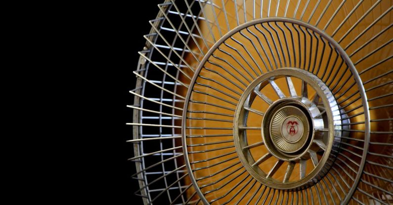 Air Conditioner - Close-up Photography of Gray Stainless Steel Fan Turned on Surrounded by Dark Background